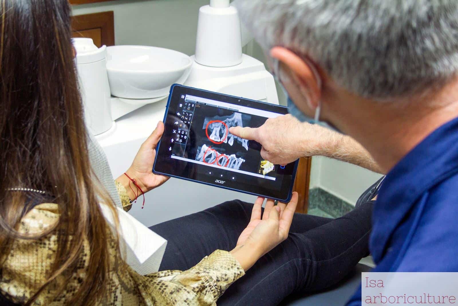 woman in blue denim jeans holding black tablet computer